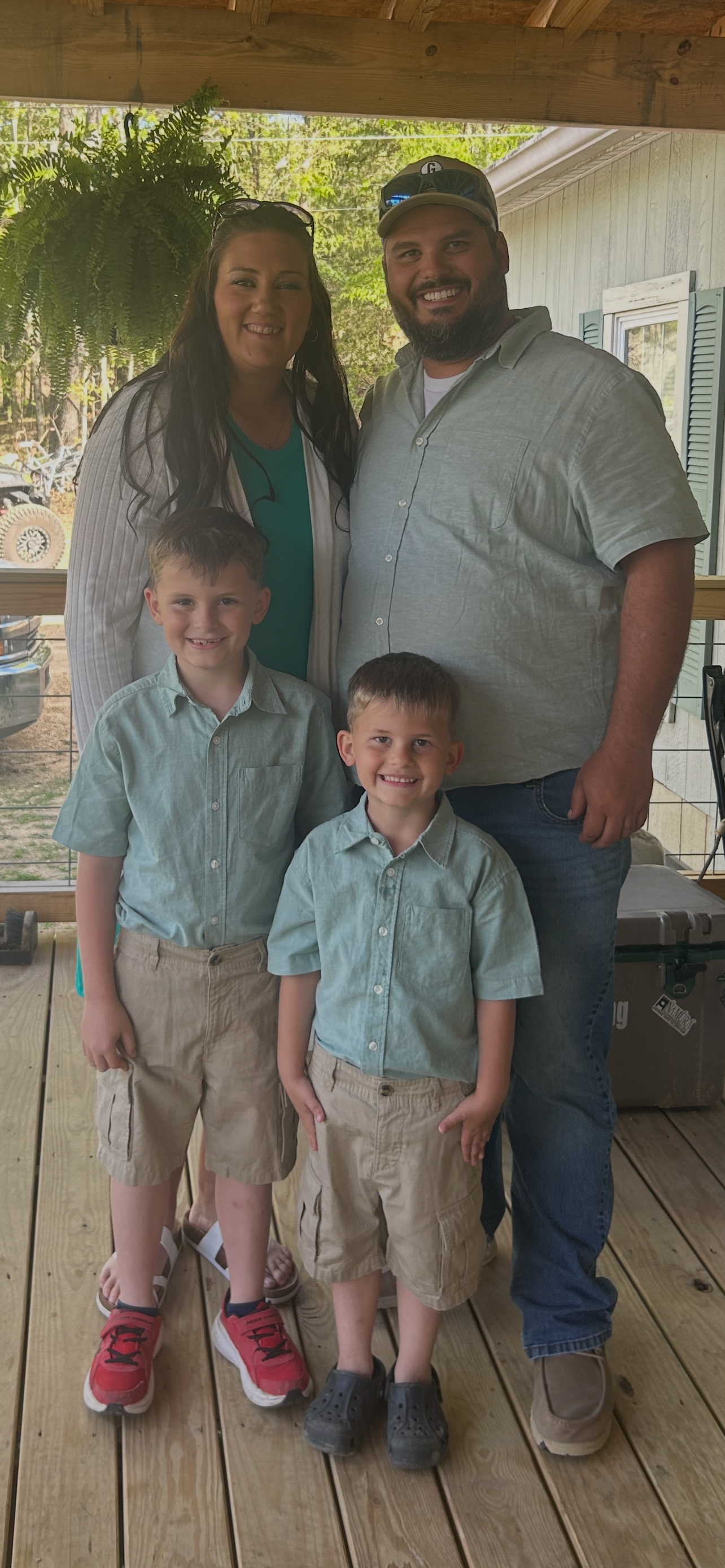 Hailey and Cody Lewis with their two sons — owners and founders of Lewis & Son's LLC